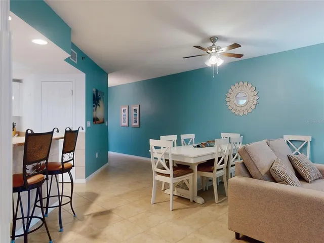 a living room with furniture and a lamp