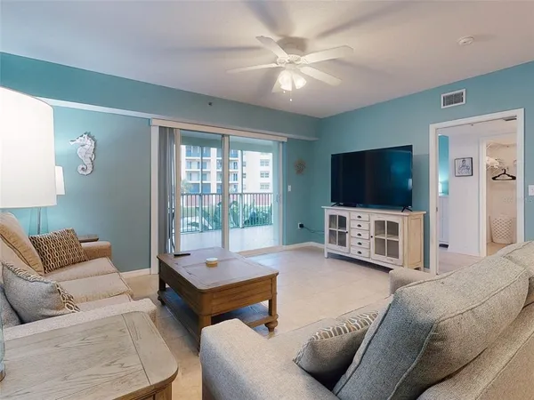 a kitchen with stainless steel appliances kitchen island granite countertop a sink and cabinets