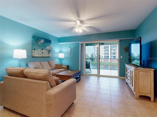 a kitchen with stainless steel appliances a refrigerator sink and microwave