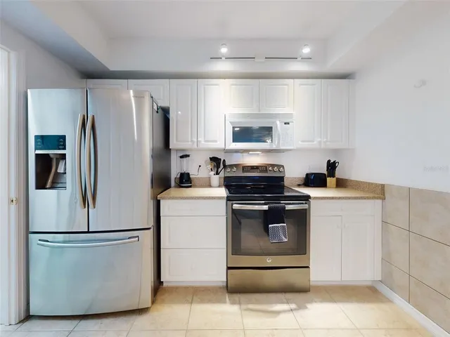 a bathroom with a sink double vanity and a mirror