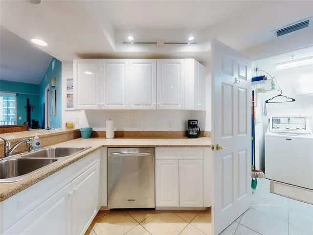 a bathroom with a double vanity sink and mirror