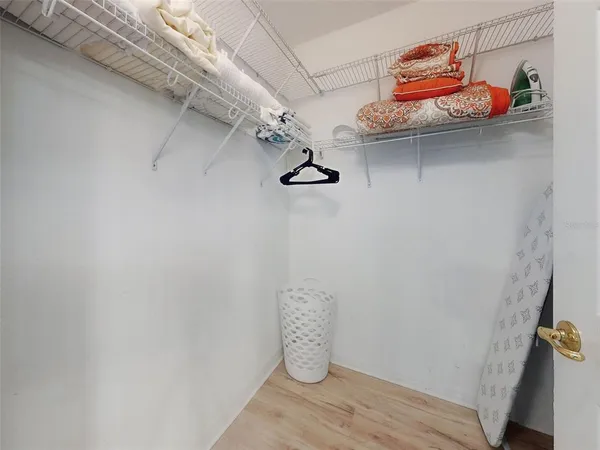 a bedroom with a large bed and a large window