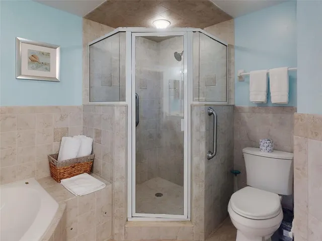 a dining room with furniture and a floor to ceiling window