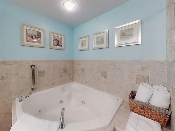 a view of a room with furniture and floor to ceiling window