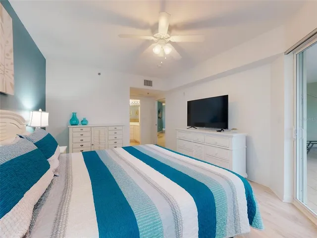 a front view of a residential apartment building with a yard