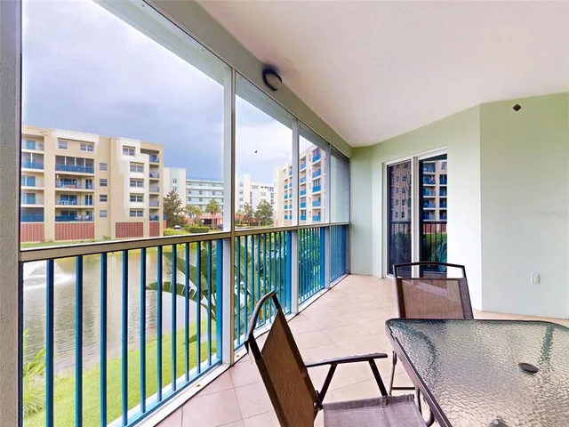 a view of a a dining room with furniture window and wooden floor