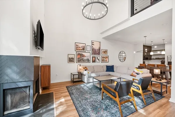 a living room with fireplace furniture and decor