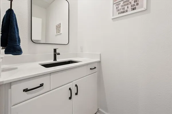a kitchen with stainless steel appliances a sink and cabinets