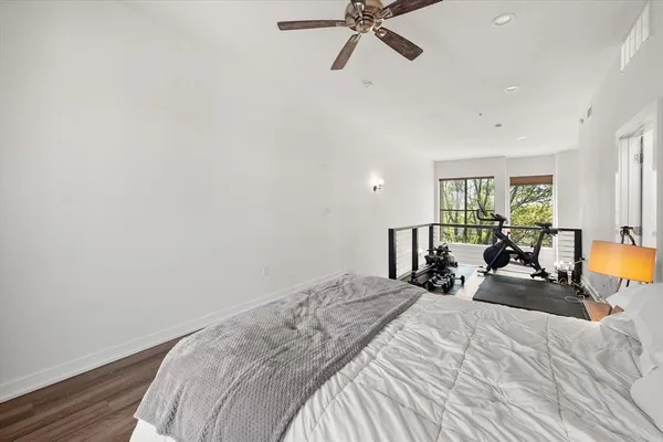 a bedroom with a bed and dresser