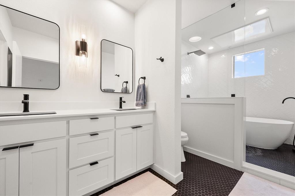 6907 Sumner Street The Colony, TX 75056 - Photo 27 of 35 Gorgeous en suite primary bath has dual sinks and a soaking tub IN the shower!