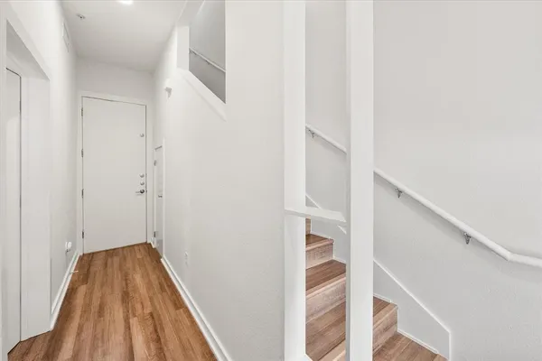 a view of entryway with wooden floor