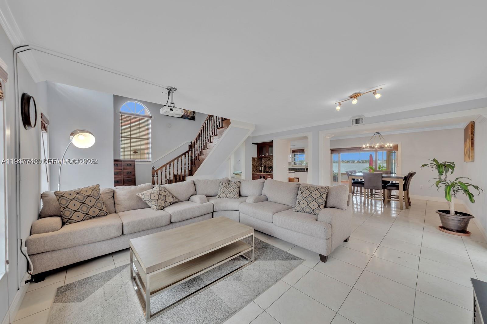 815 Northwest 126th Court Miami, FL 33182 - Photo 8 of 20 a living room with furniture and wooden floor