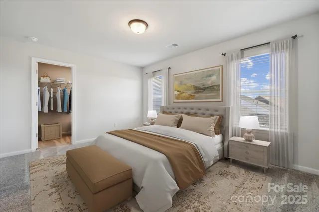 a bedroom with a bed and a painting on the wall