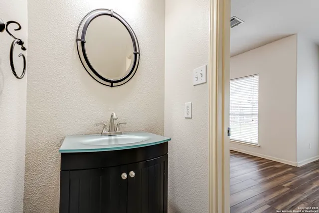 a bathroom with a sink and a mirror
