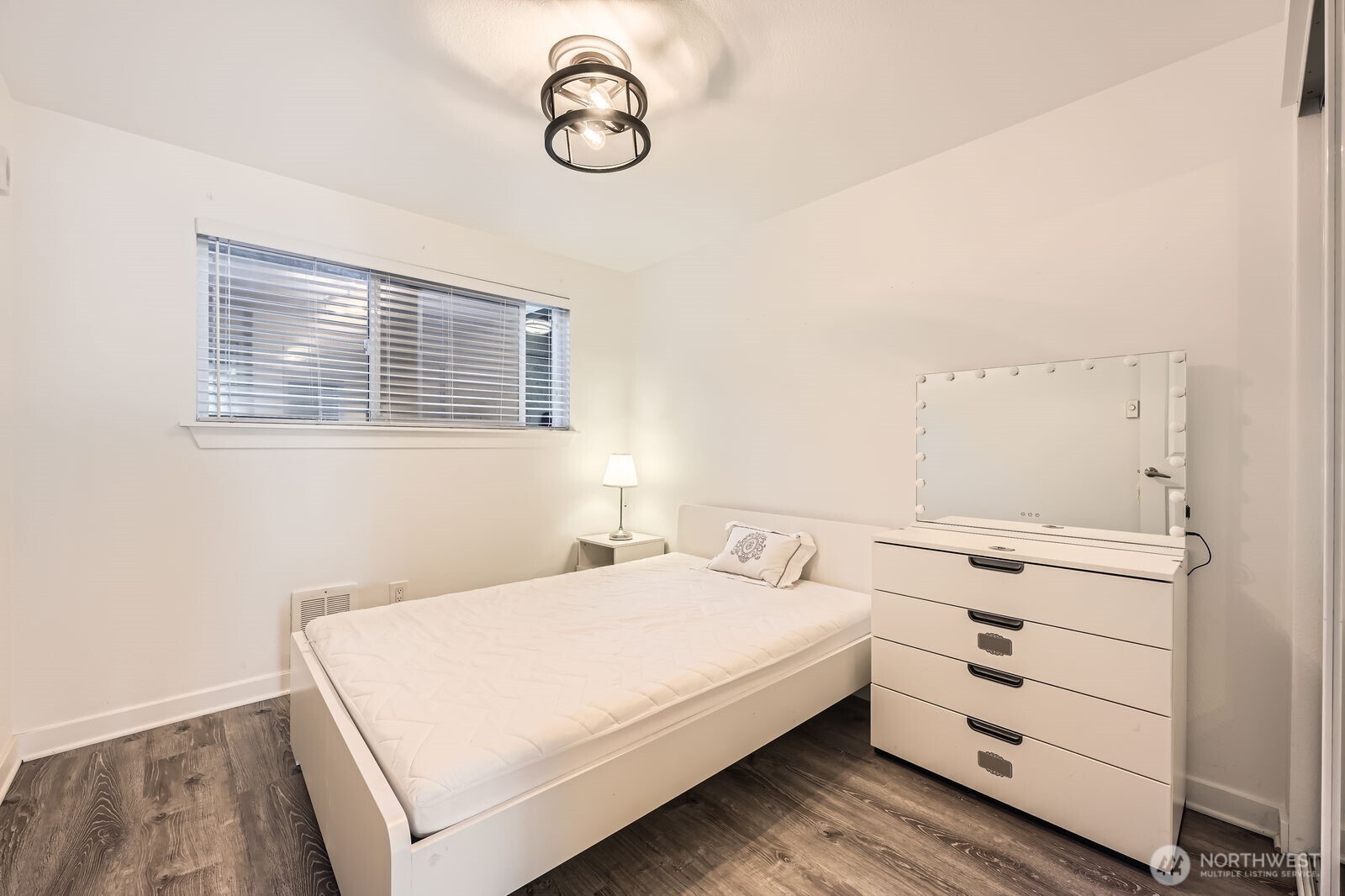 701 122nd Avenue Northeast, Unit 102 Bellevue, WA 98005 - Photo 12 of 14 a bedroom with a bed and a window