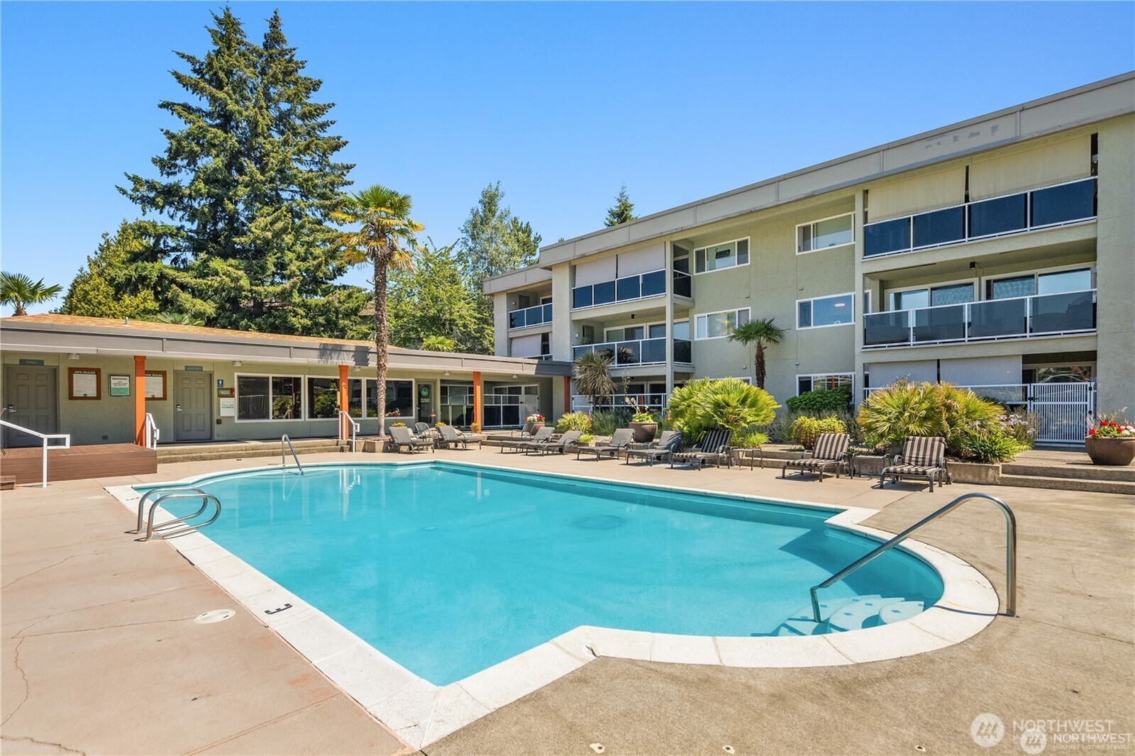 701 122nd Avenue Northeast, Unit 102 Bellevue, WA 98005 - Photo 14 of 14 a view of a house with swimming pool
