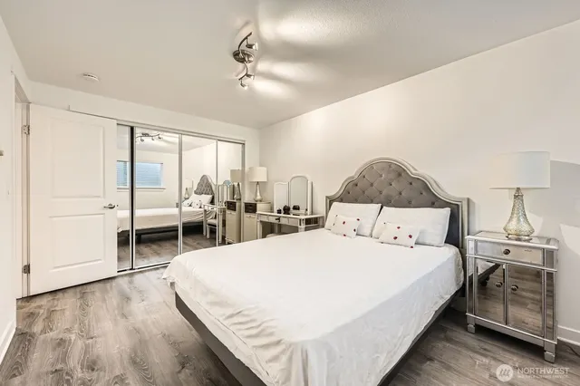 a bedroom with a bed and a desk