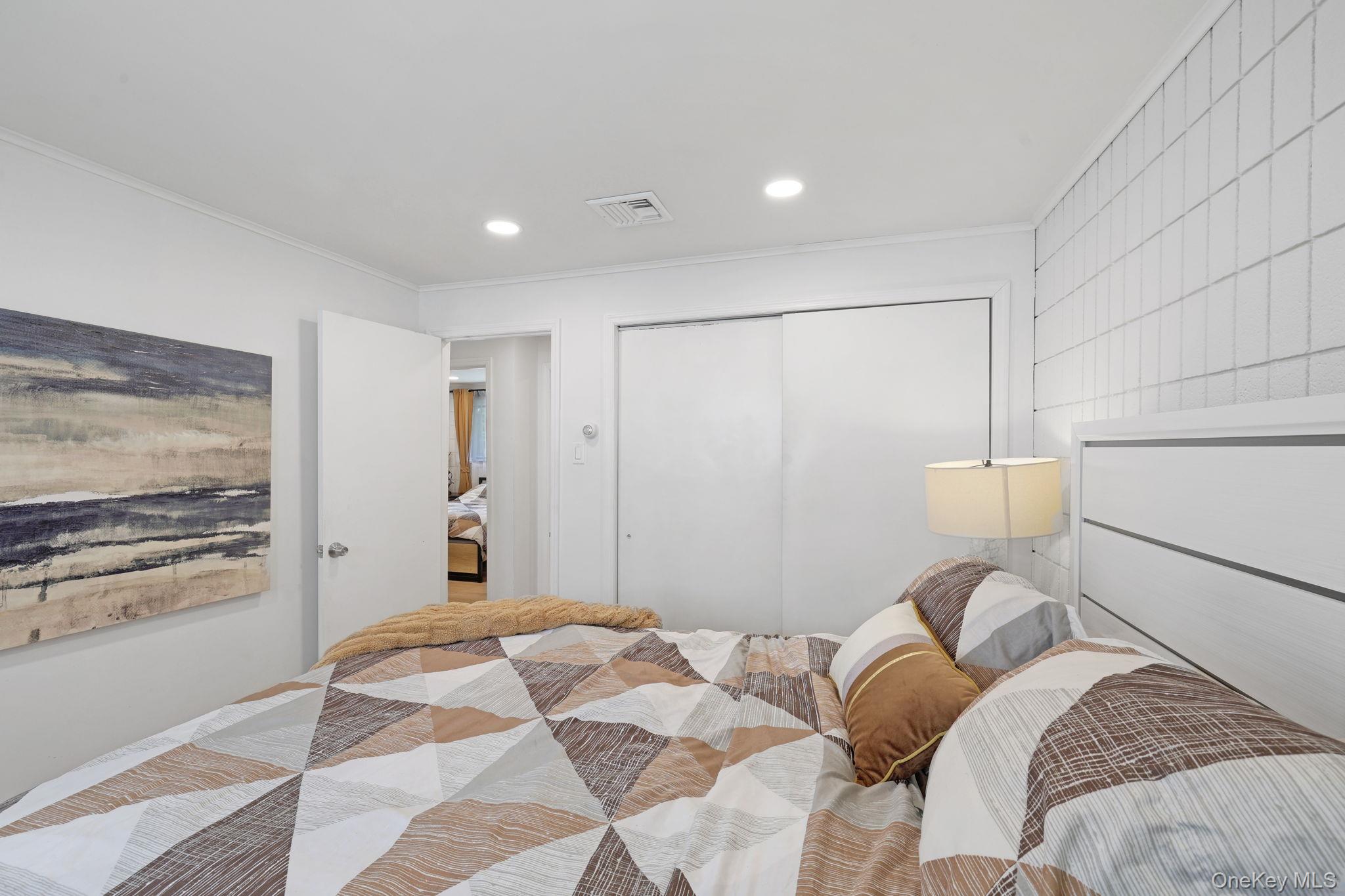 35 Kroeger Road Monticello, NY 12701 - Photo 14 of 29 a bedroom with a bed and a painting on the wall