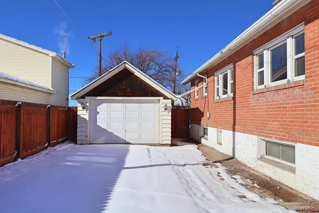 a front view of a house with a garage
