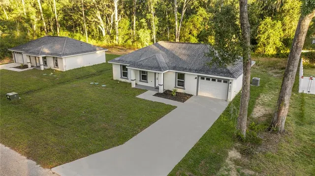 a view of house with garden