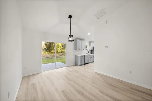a view of a kitchen with wooden floor