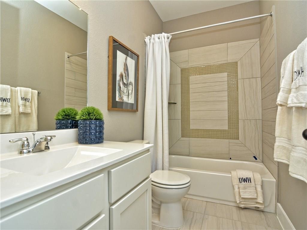 12504 Red Sparrow Street, Unit 1 Austin, TX 78729 - Photo 22 of 22 a bathroom with a sink a toilet and shower