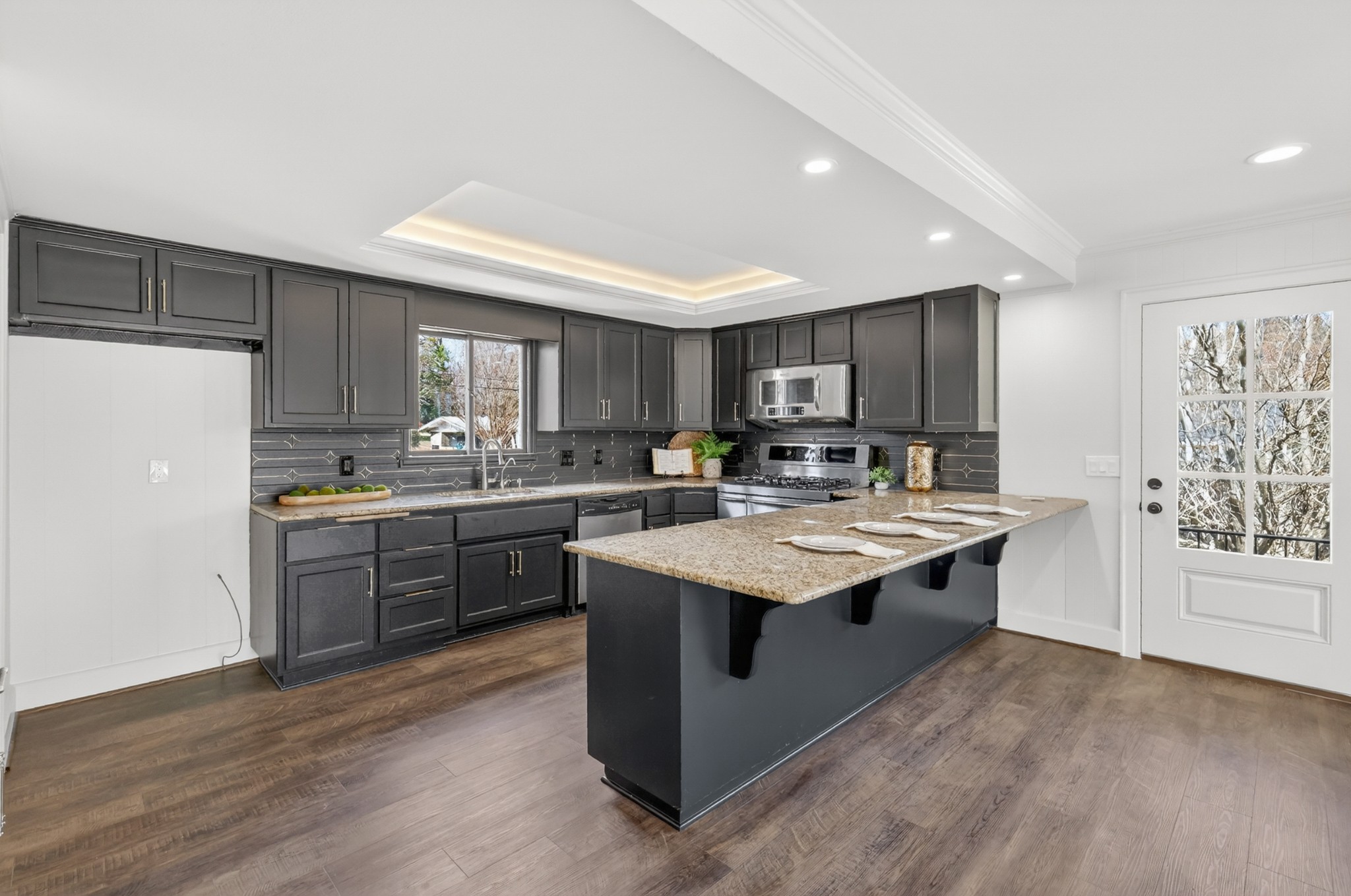 91 Country Club Terrace Winchester, TN 37398 - Photo 18 of 74 a kitchen with kitchen island granite countertop a sink appliances and cabinets