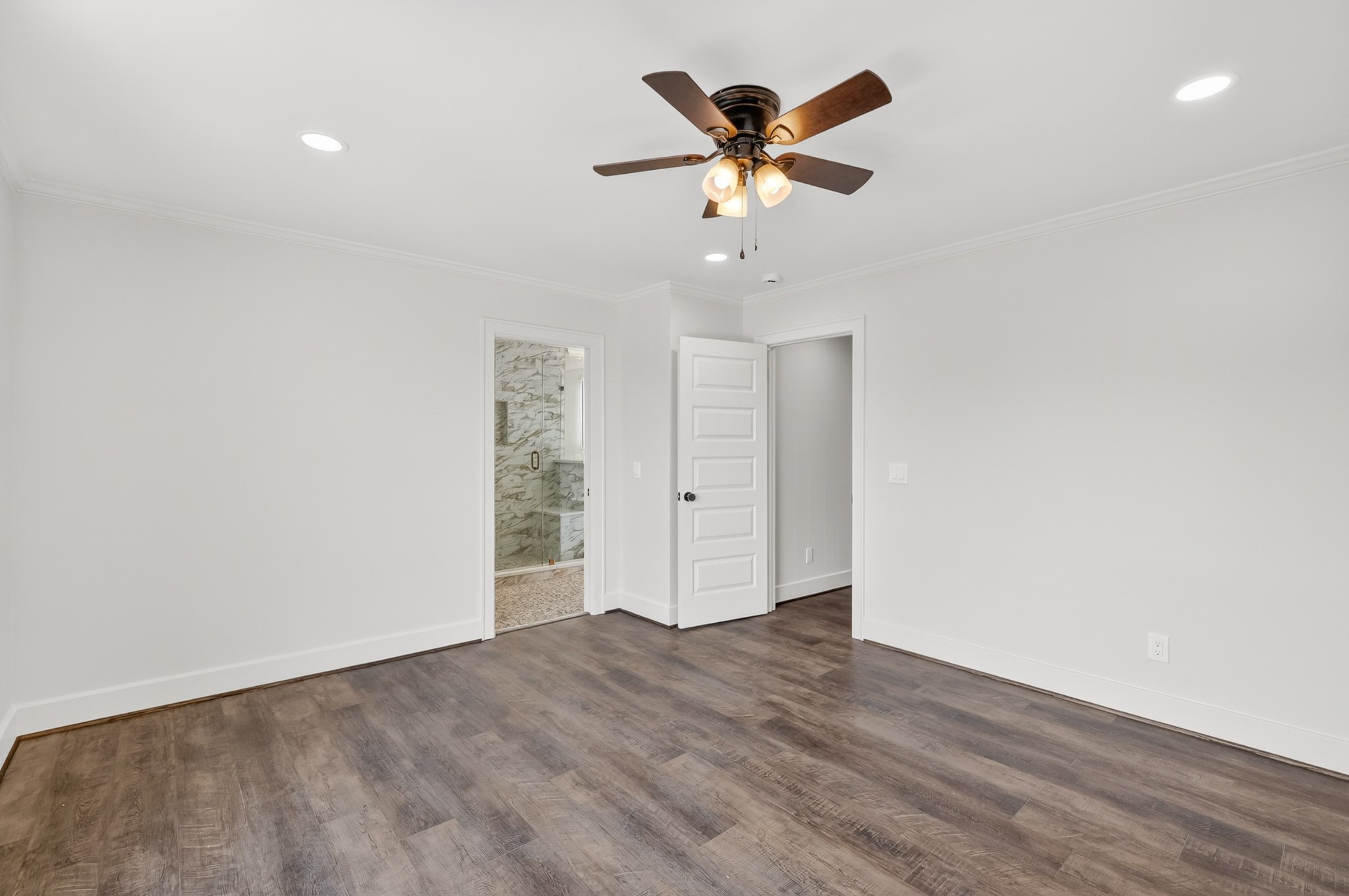 91 Country Club Terrace Winchester, TN 37398 - Photo 30 of 74 an empty room with wooden floor chandelier fan and windows