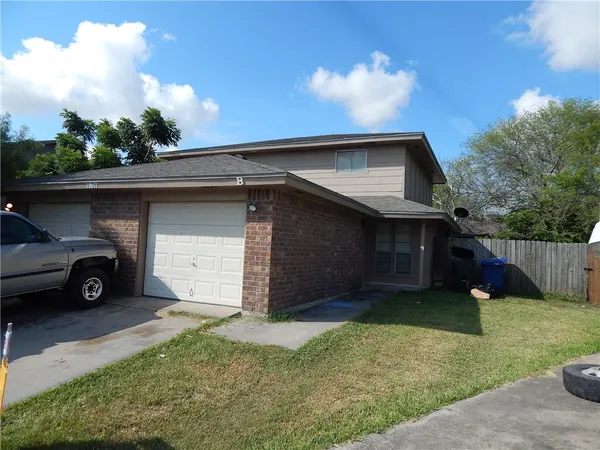 a house view with a garden space