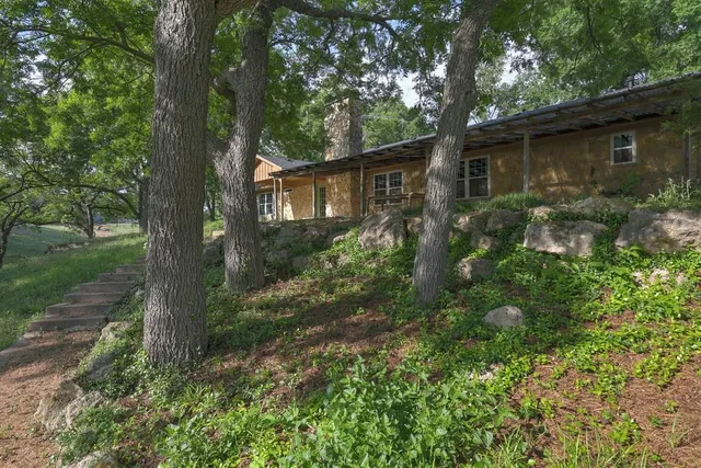 a backyard of a house with lots of green space