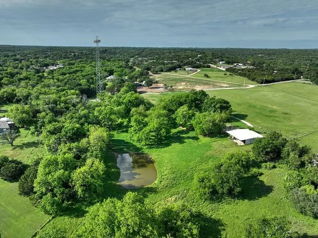 a view of a porch with a wooden fence