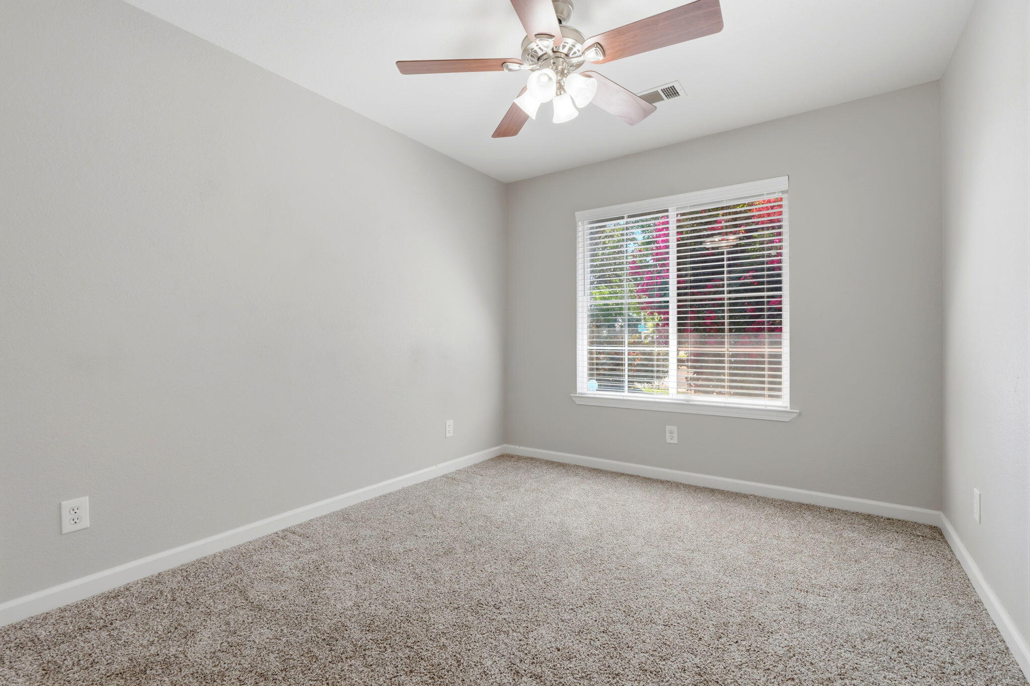 481 Katelyn Court Exeter, CA 93221 - Photo 12 of 33 a view of wooden floor and windows in a room