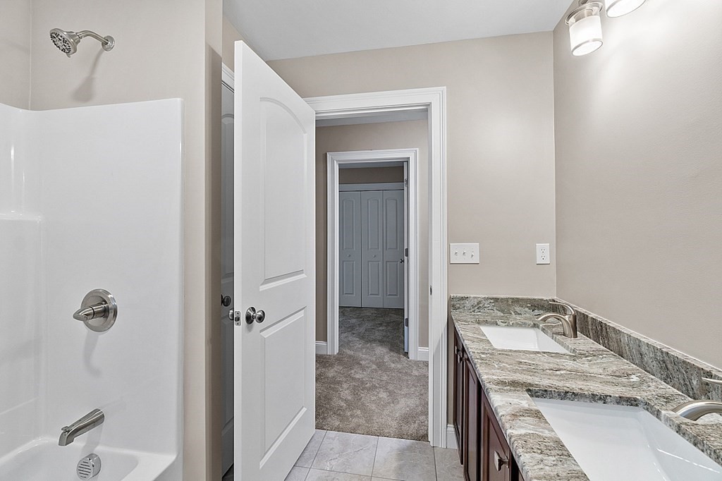 150 French Road, Unit LOT 4 Templeton, MA 01468 - Photo 20 of 28 a bathroom with a granite countertop sink a mirror and shower