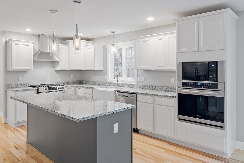 150 French Road, Unit LOT 4 Templeton, MA 01468 - Photo 7 of 28 a kitchen with stainless steel appliances granite countertop a sink a stove a microwave and a refrigerator
