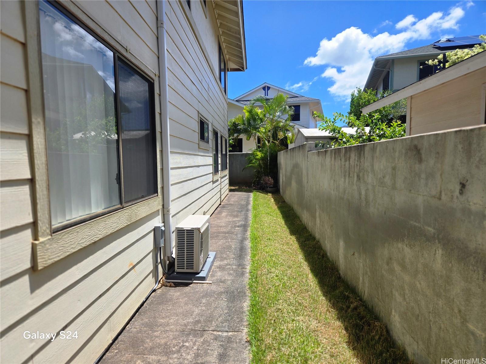 94-1008 Makakoa Loop Waipahu, HI 96797 - Photo 11 of 24 a view of a house with a balcony