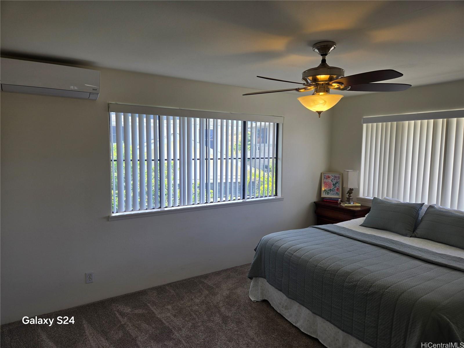 94-1008 Makakoa Loop Waipahu, HI 96797 - Photo 12 of 24 a bedroom with a bed and a window