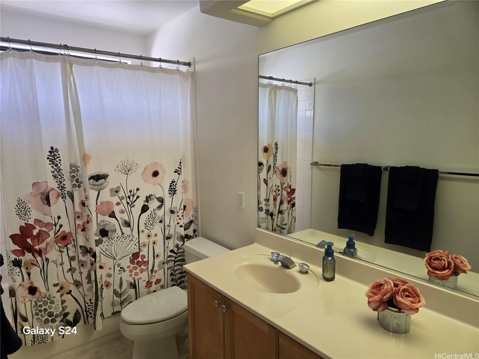 94-1008 Makakoa Loop Waipahu, HI 96797 - Photo 13 of 24 a bathroom with a sink toilet and shower