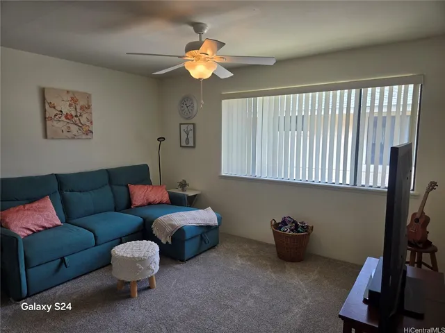 a living room with furniture and a window
