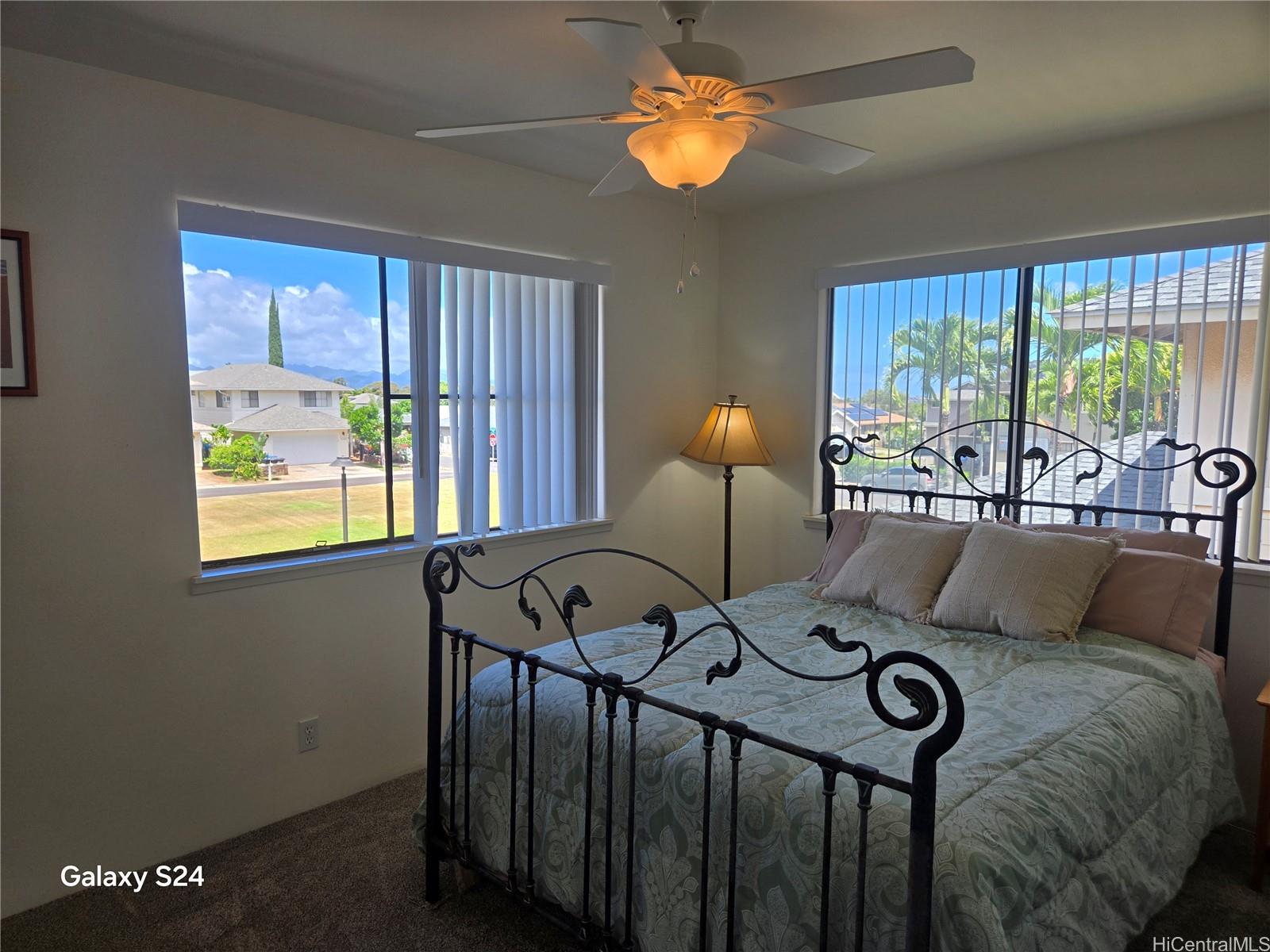 94-1008 Makakoa Loop Waipahu, HI 96797 - Photo 16 of 24 a living room with furniture and a large window