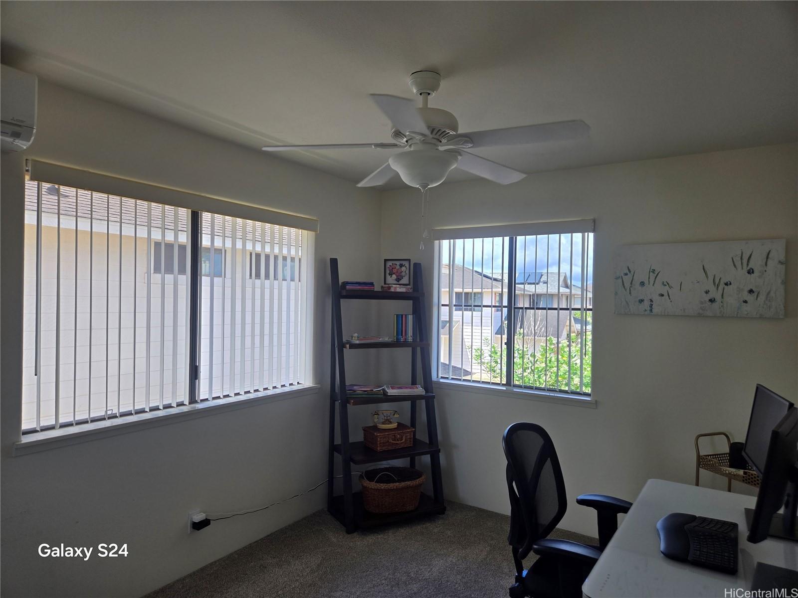 94-1008 Makakoa Loop Waipahu, HI 96797 - Photo 17 of 24 a view of a workspace with furniture and a window