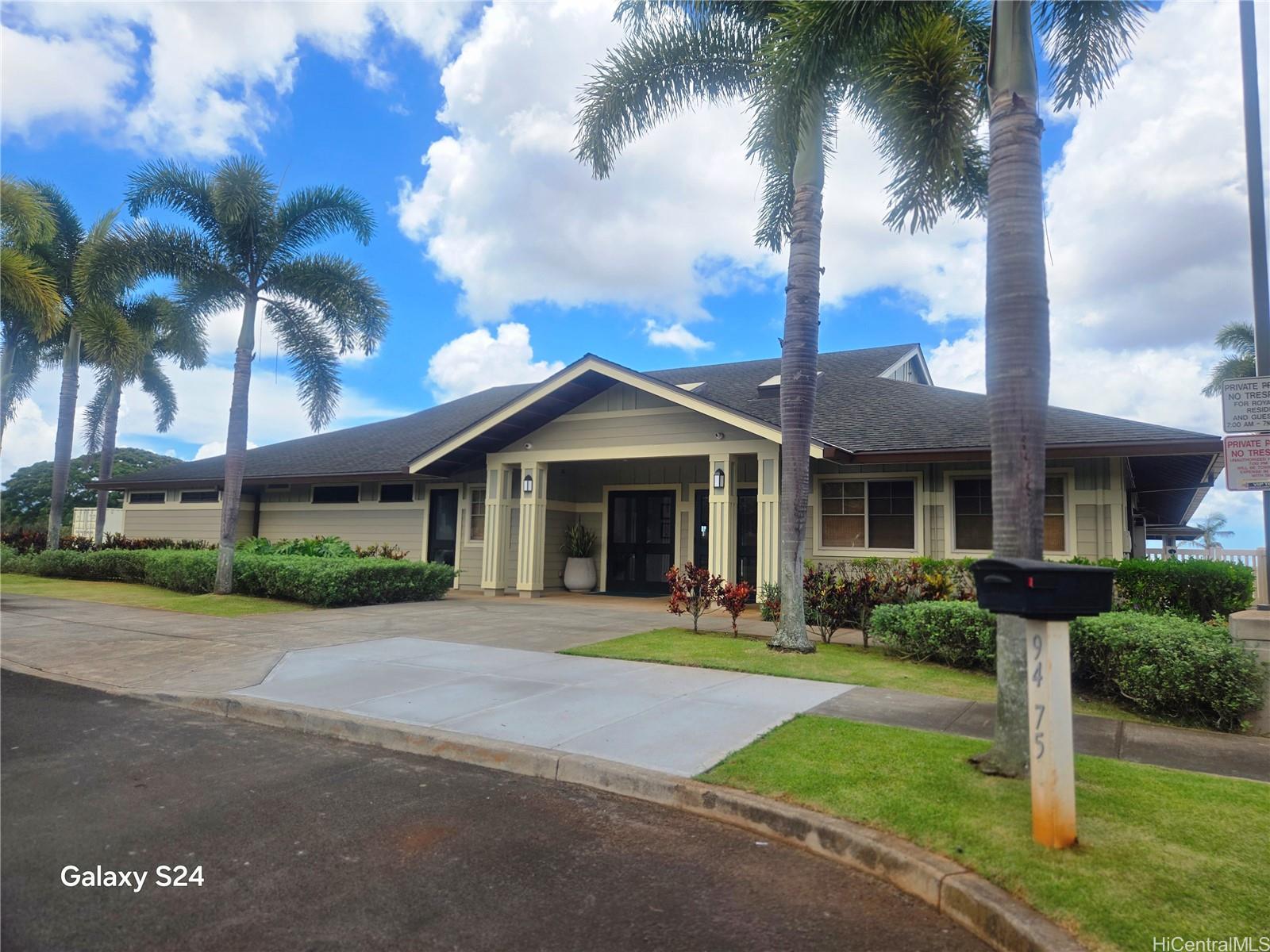 94-1008 Makakoa Loop Waipahu, HI 96797 - Photo 19 of 24 a front view of a house with a yard and potted plants