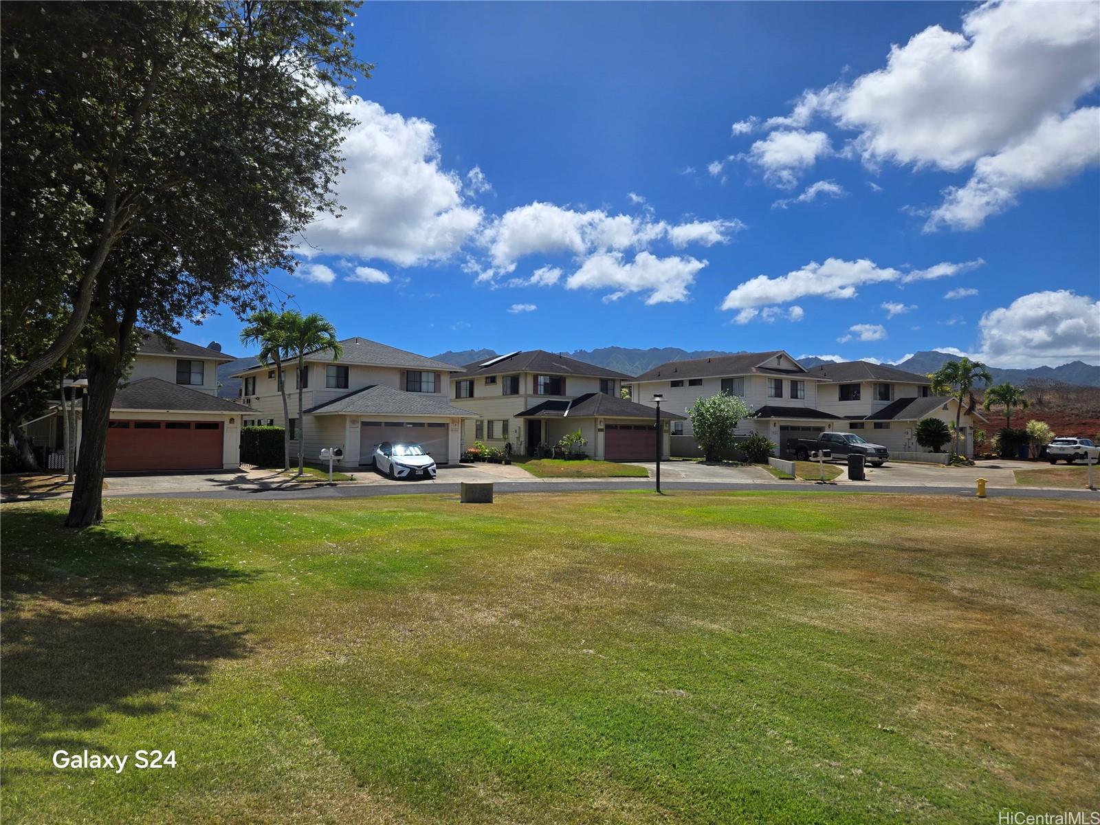 94-1008 Makakoa Loop Waipahu, HI 96797 - Photo 23 of 24 a front view of a house with a garden