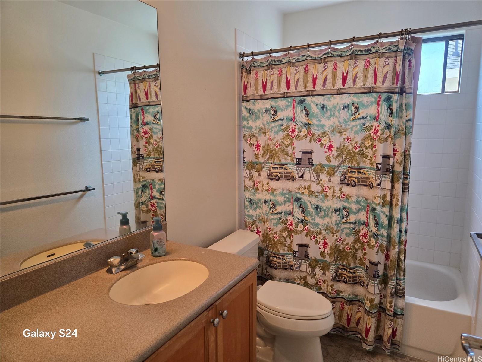 94-1008 Makakoa Loop Waipahu, HI 96797 - Photo 8 of 24 a bathroom with a sink toilet and shower