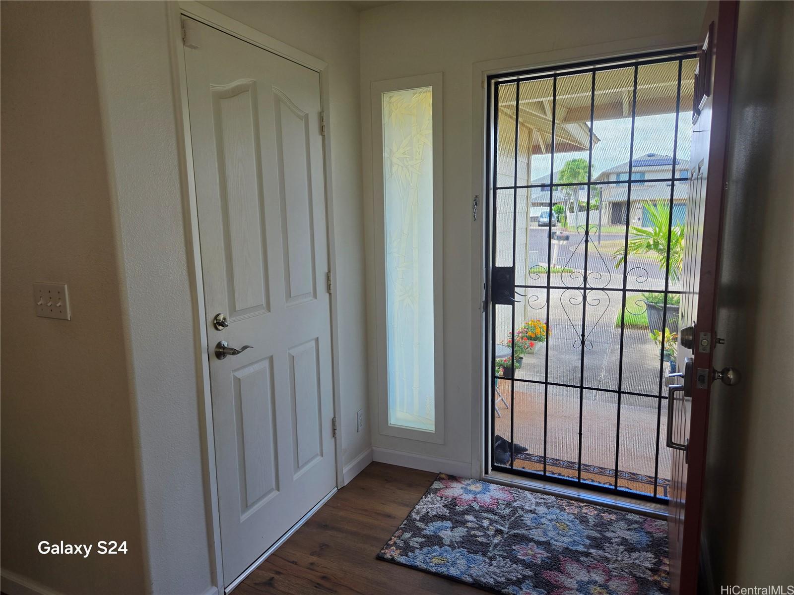 94-1008 Makakoa Loop Waipahu, HI 96797 - Photo 9 of 24 a view of entryway with floor to ceiling window
