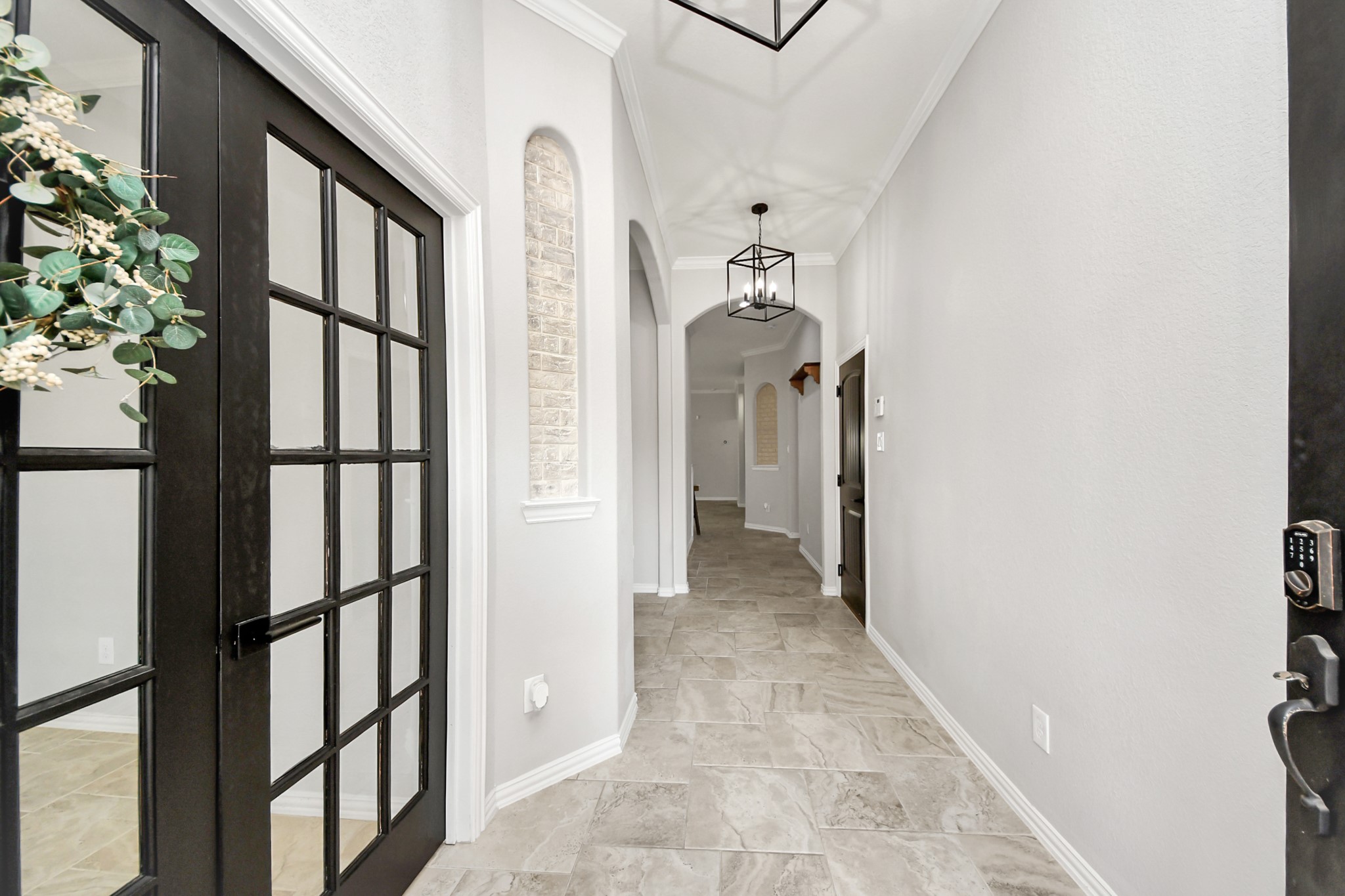 3825 Enchanted Timbers Lane Spring, TX 77386 - Photo 3 of 30 As you walk in, notice the stunning double doors on the left leading you into the office!