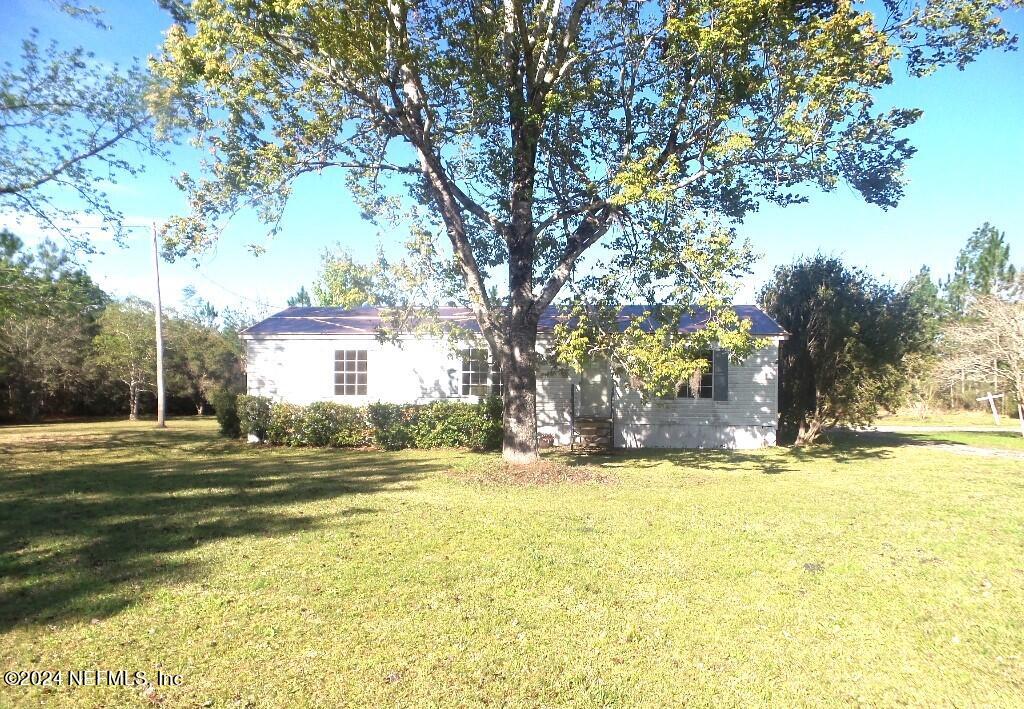1831 Forbes Road, Unit 1 St. Augustine, FL 32092 - Photo 1 of 20 a view of a house with a yard