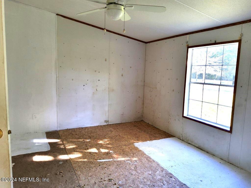1831 Forbes Road, Unit 1 St. Augustine, FL 32092 - Photo 17 of 20 a view of a big room with wooden floor and windows