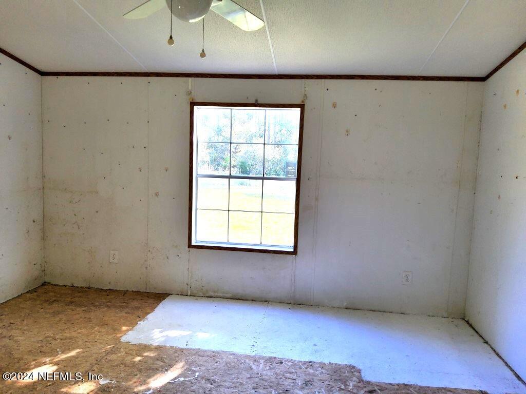 1831 Forbes Road, Unit 1 St. Augustine, FL 32092 - Photo 18 of 20 a view of an empty room with a window