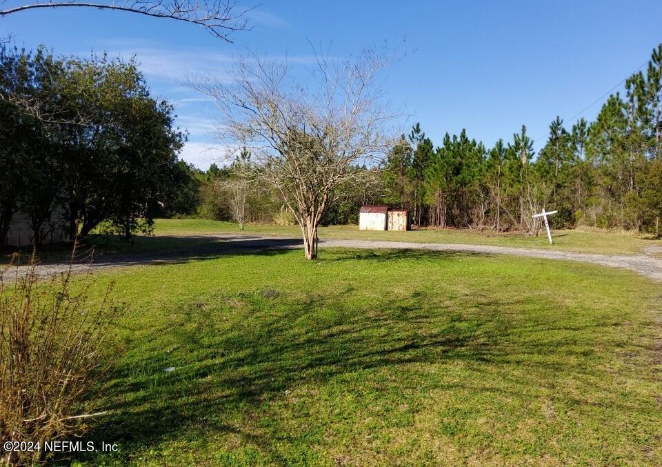 1831 Forbes Road, Unit 1 St. Augustine, FL 32092 - Photo 20 of 20 a view of a swimming pool with a yard