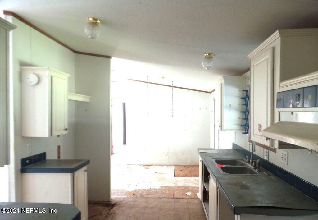 1831 Forbes Road, Unit 1 St. Augustine, FL 32092 - Photo 8 of 20 a workspace with furniture and window
